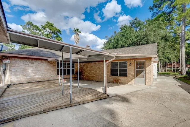 a view of a house with a garage and yard