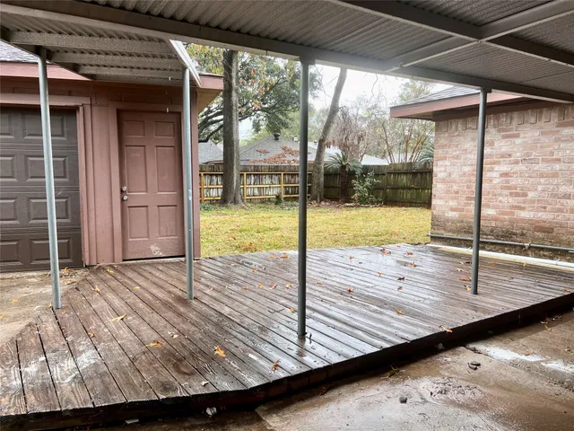 a view of a balcony with wooden floor