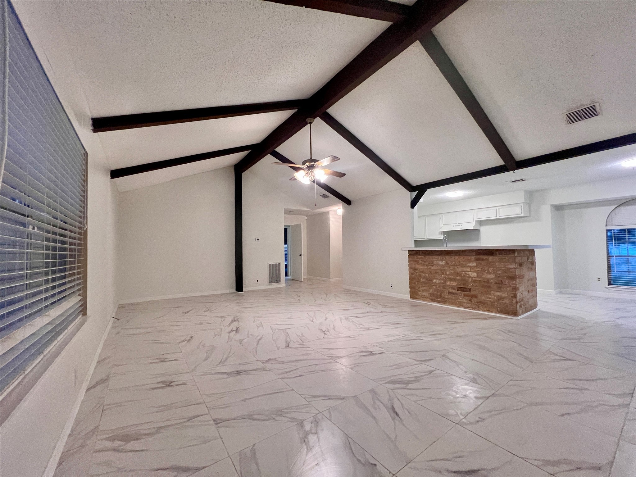 23111 Bayleaf Drive Spring, TX 77373 - Photo 6 of 28 a view of empty room with floor to ceiling window and fireplace
