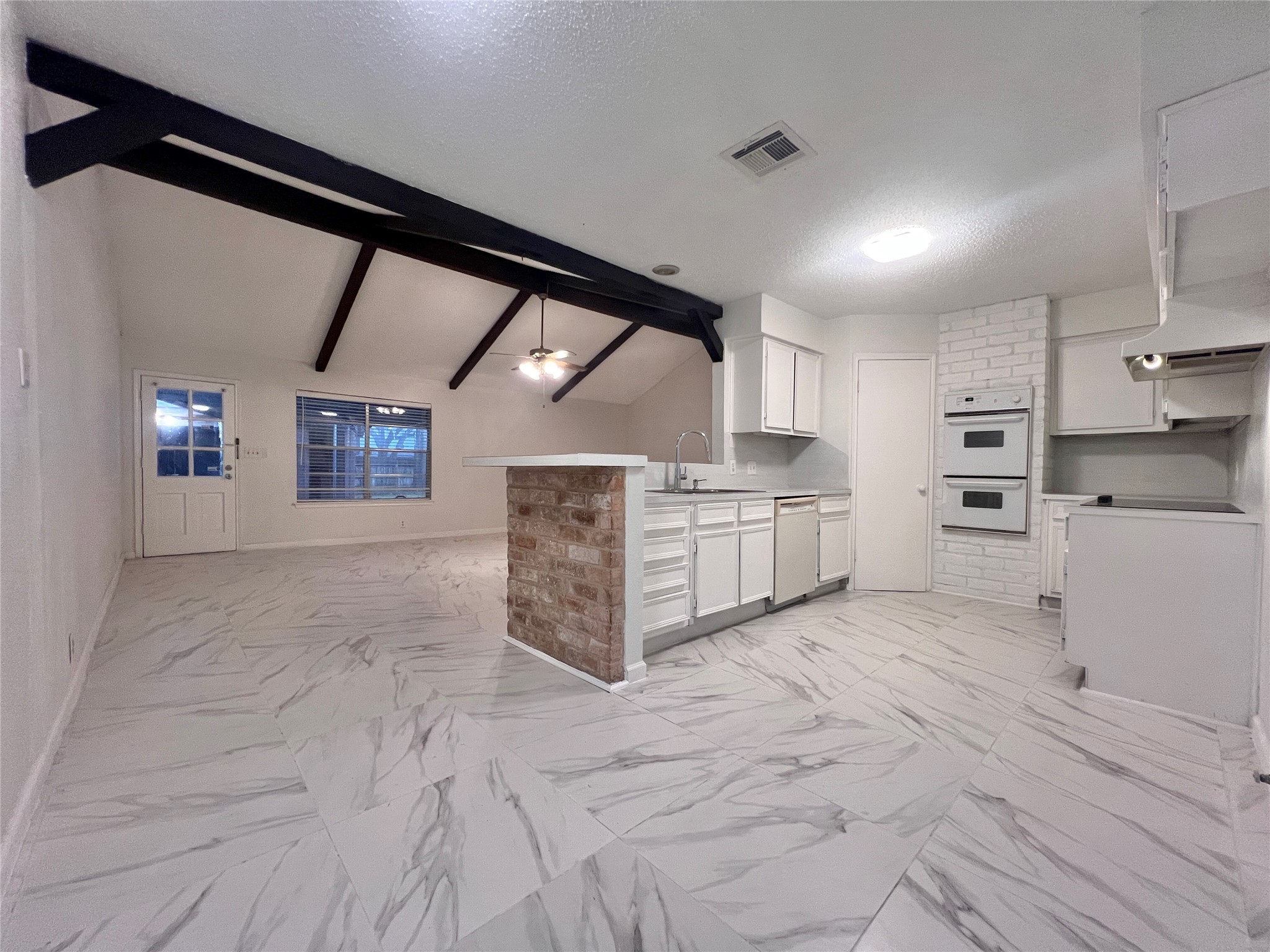 23111 Bayleaf Drive Spring, TX 77373 - Photo 8 of 28 a large room with stainless steel appliances kitchen island granite countertop a stove a sink and a refrigerator