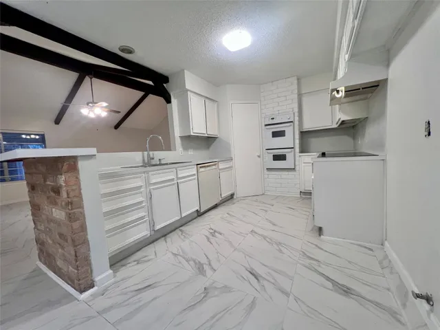 a room with cabinets and wooden floor