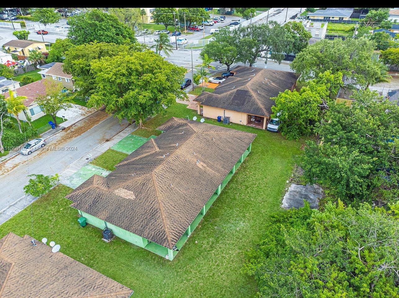 2320 Northwest 52nd Street, Unit A Miami, FL 33142 - Photo 3 of 8 an aerial view of a house