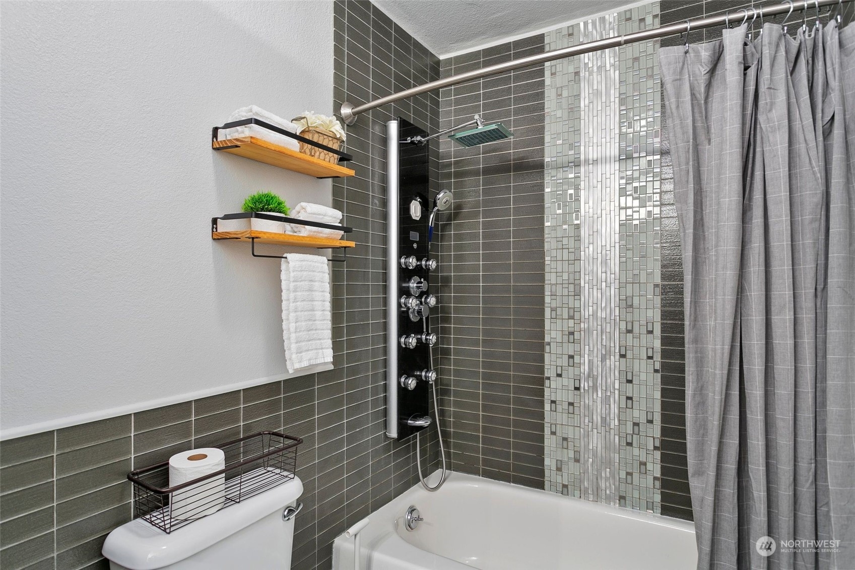 1425 South Puget Drive, Unit 308 Renton, WA 98055 - Photo 11 of 23 a bathroom with a shower toilet and sink