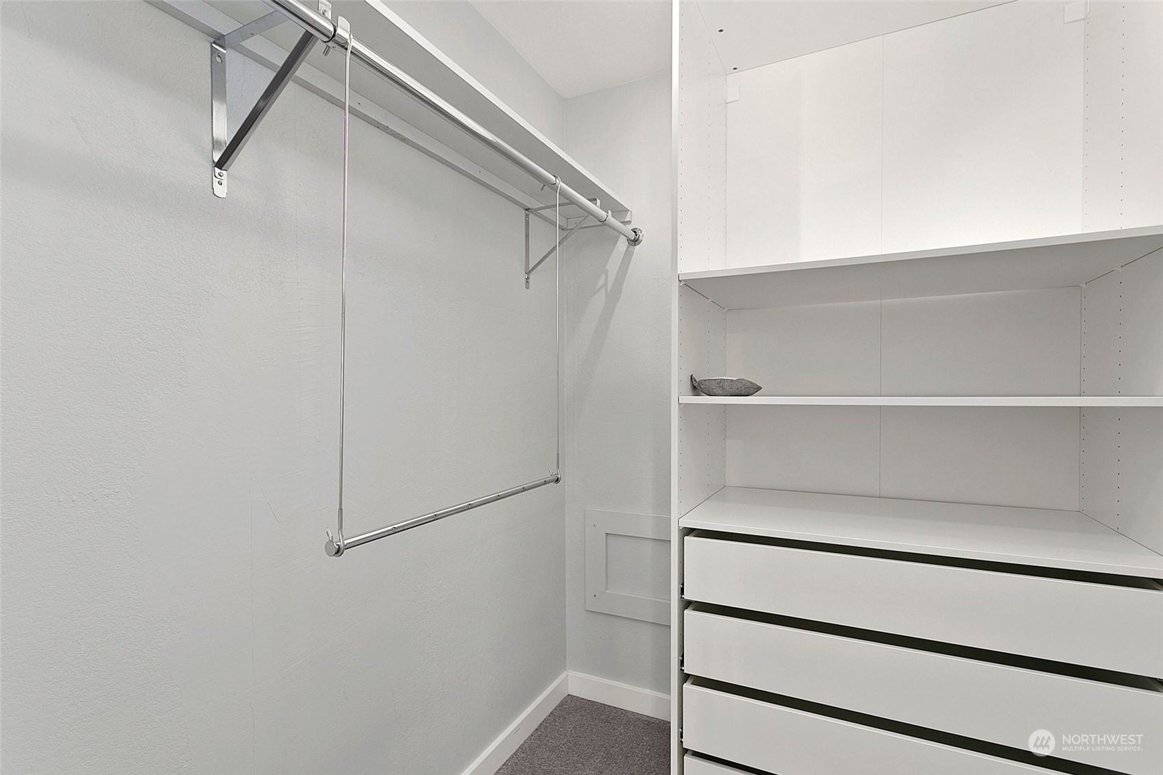 1425 South Puget Drive, Unit 308 Renton, WA 98055 - Photo 12 of 23 a view of walk in closet with empty racks