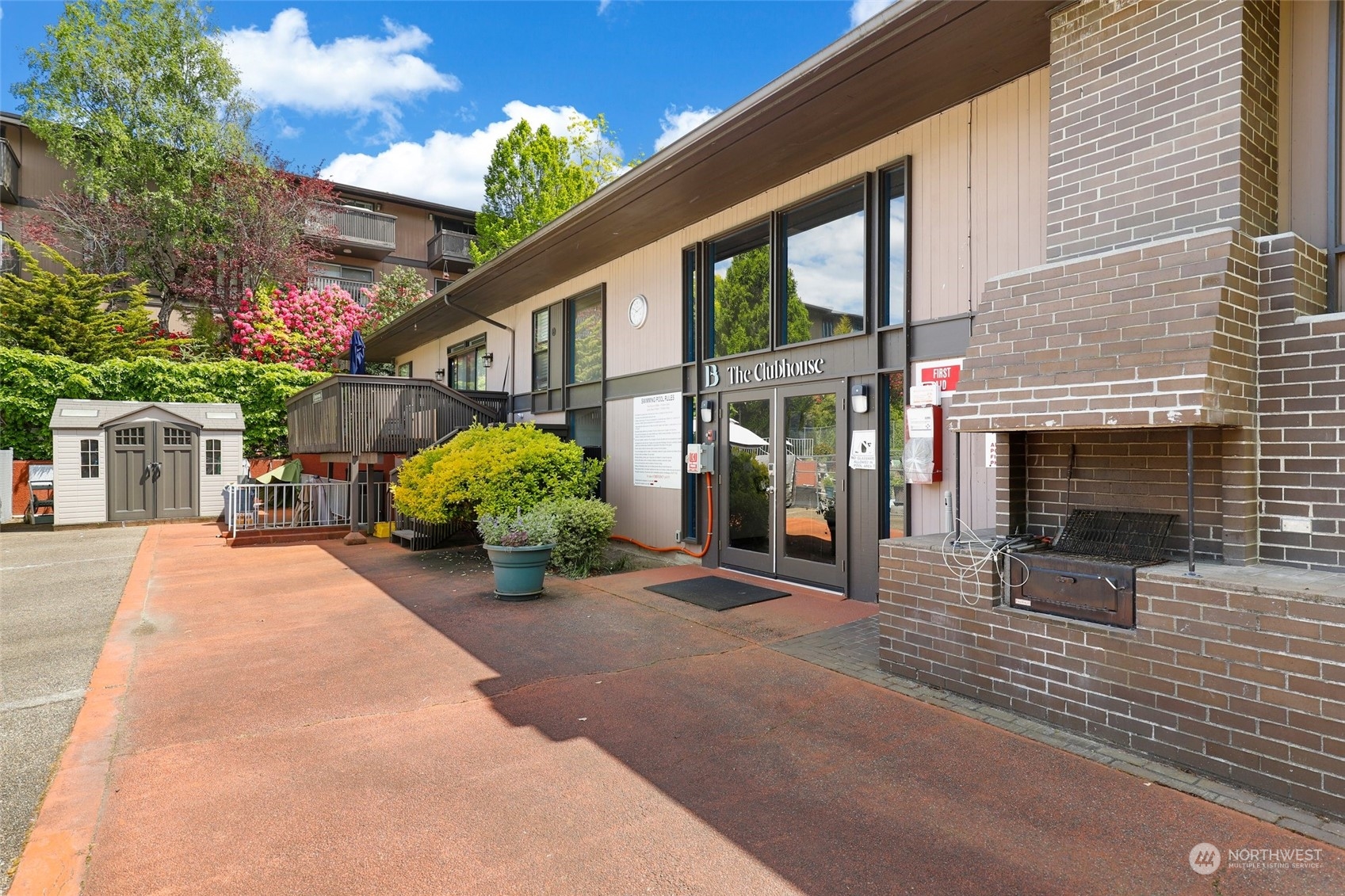 1425 South Puget Drive, Unit 308 Renton, WA 98055 - Photo 18 of 23 a view of a house with yard and a garden