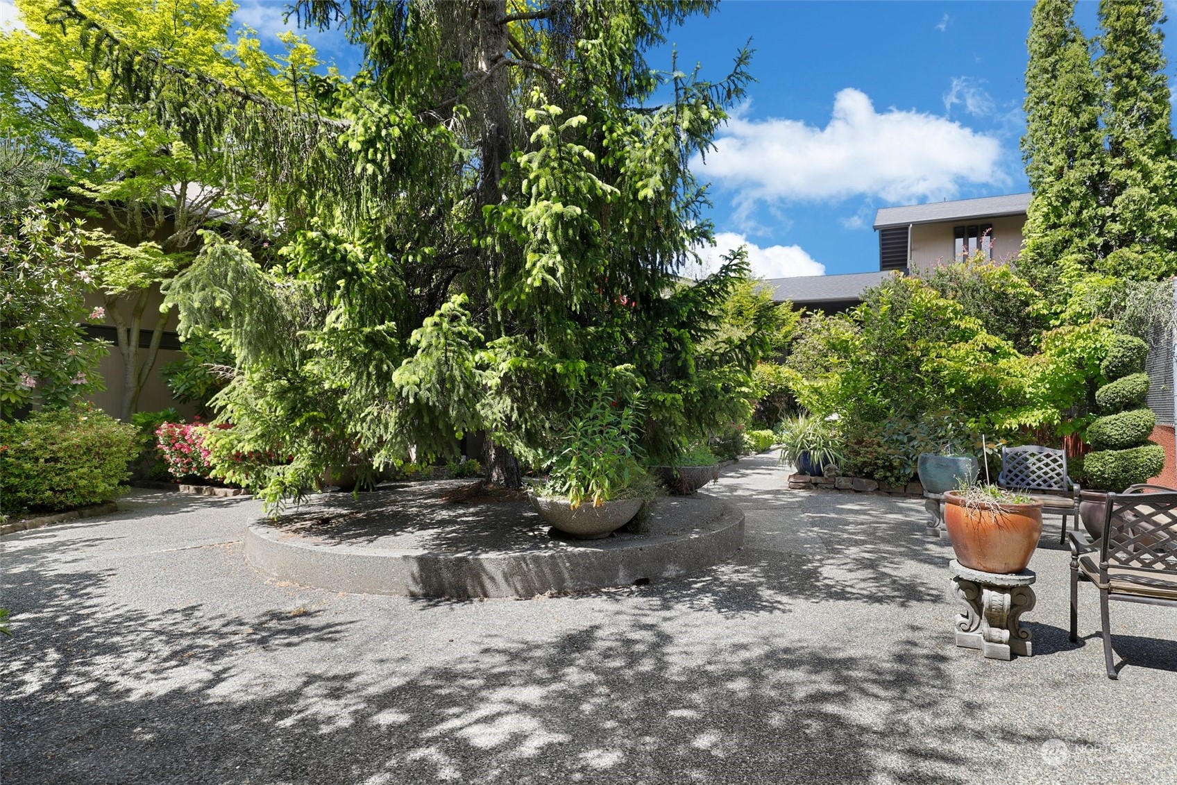 1425 South Puget Drive, Unit 308 Renton, WA 98055 - Photo 21 of 23 a view of a backyard with sitting area