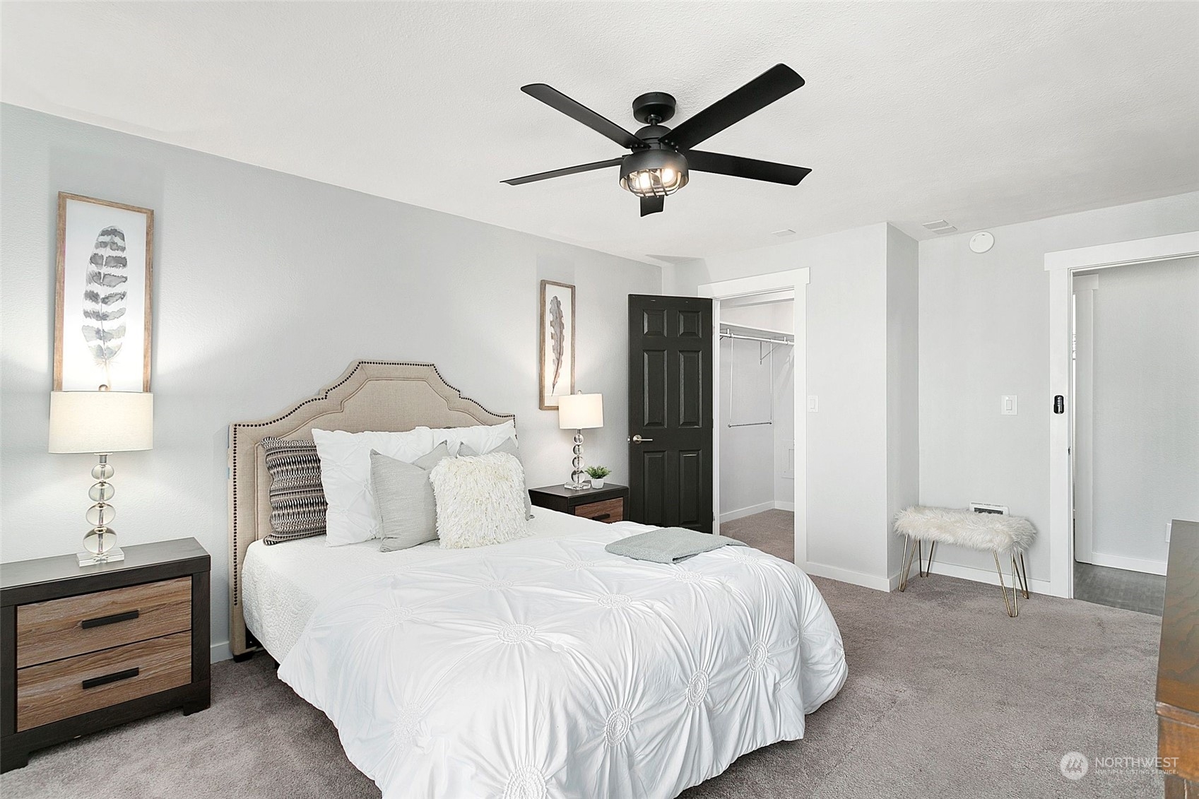 1425 South Puget Drive, Unit 308 Renton, WA 98055 - Photo 9 of 23 a bedroom with a bed and a painting on the wall