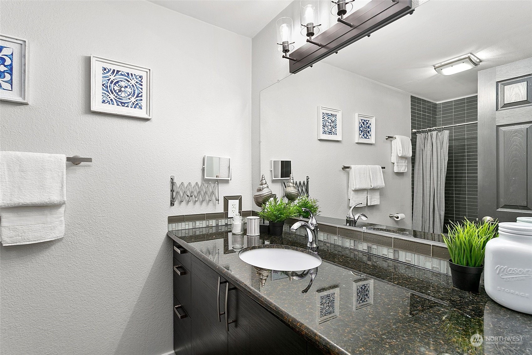 1425 South Puget Drive, Unit 308 Renton, WA 98055 - Photo 10 of 23 a dining room with furniture and a chandelier