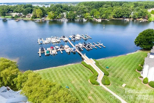 an aerial view of a house with a lake view