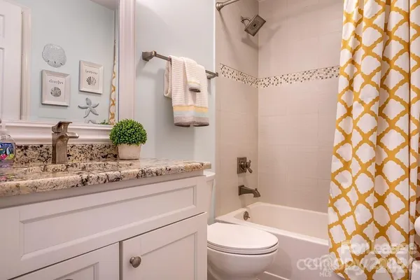 a bathroom with a sink a toilet and a bathtub