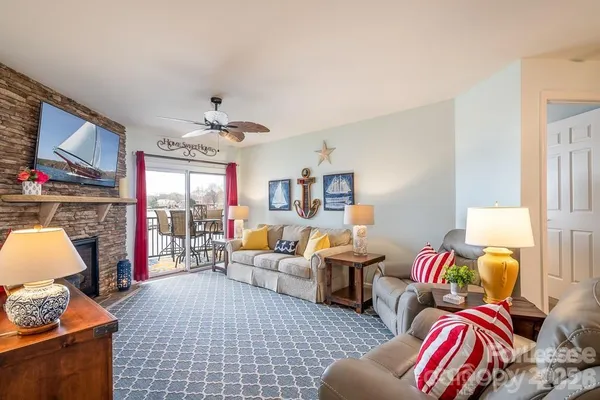 a living room with furniture fireplace and a flat screen tv