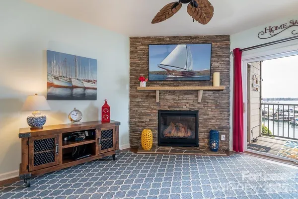 a living room with furniture and a fireplace