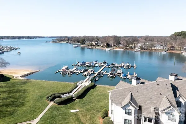 an aerial view of a house with a lake view