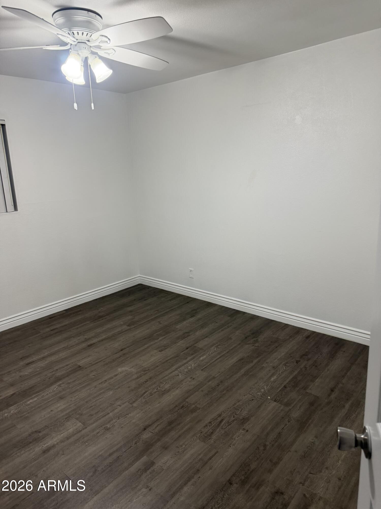 1702 West Tuckey Lane, Unit 103 Phoenix, AZ 85015 - Photo 13 of 13 wooden floor in an empty room