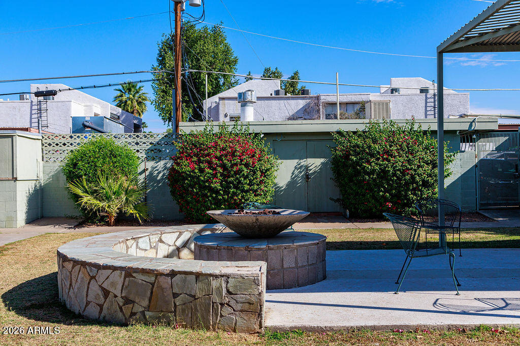 1702 West Tuckey Lane, Unit 103 Phoenix, AZ 85015 - Photo 2 of 13 a view of a fountain is sitting in front of house
