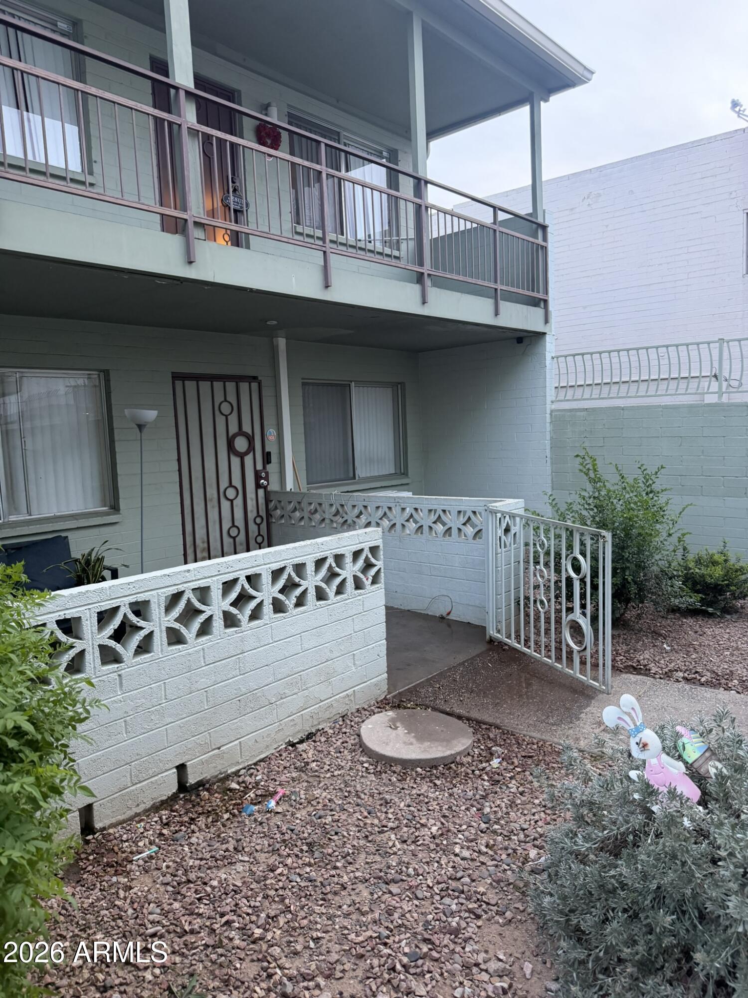 1702 West Tuckey Lane, Unit 103 Phoenix, AZ 85015 - Photo 4 of 13 a view of a house with a outdoor space