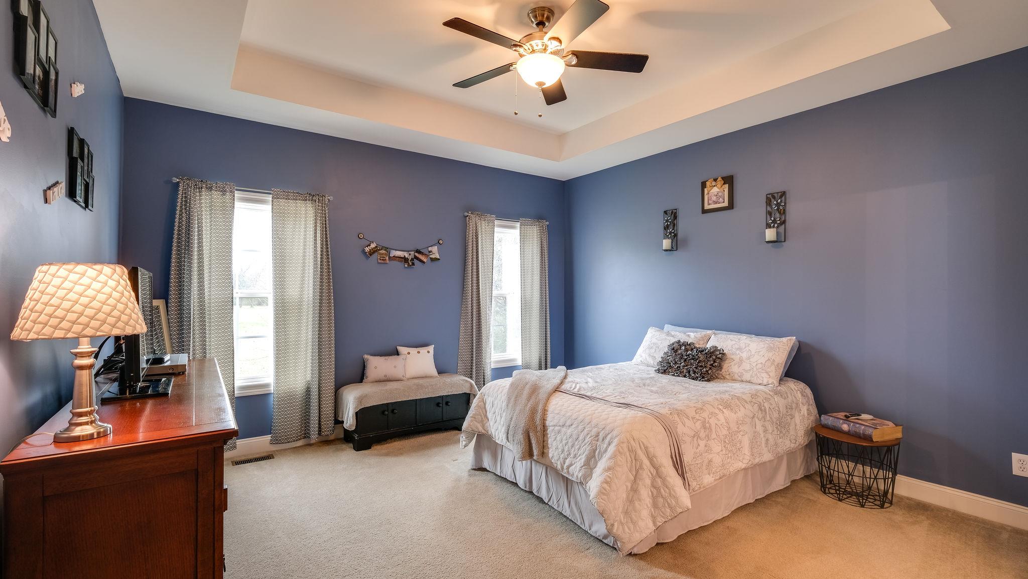 7920 Powells Chapel Road Murfreesboro, TN 37129 - Photo 11 of 29 a bedroom with a bed and a lamp on dresser