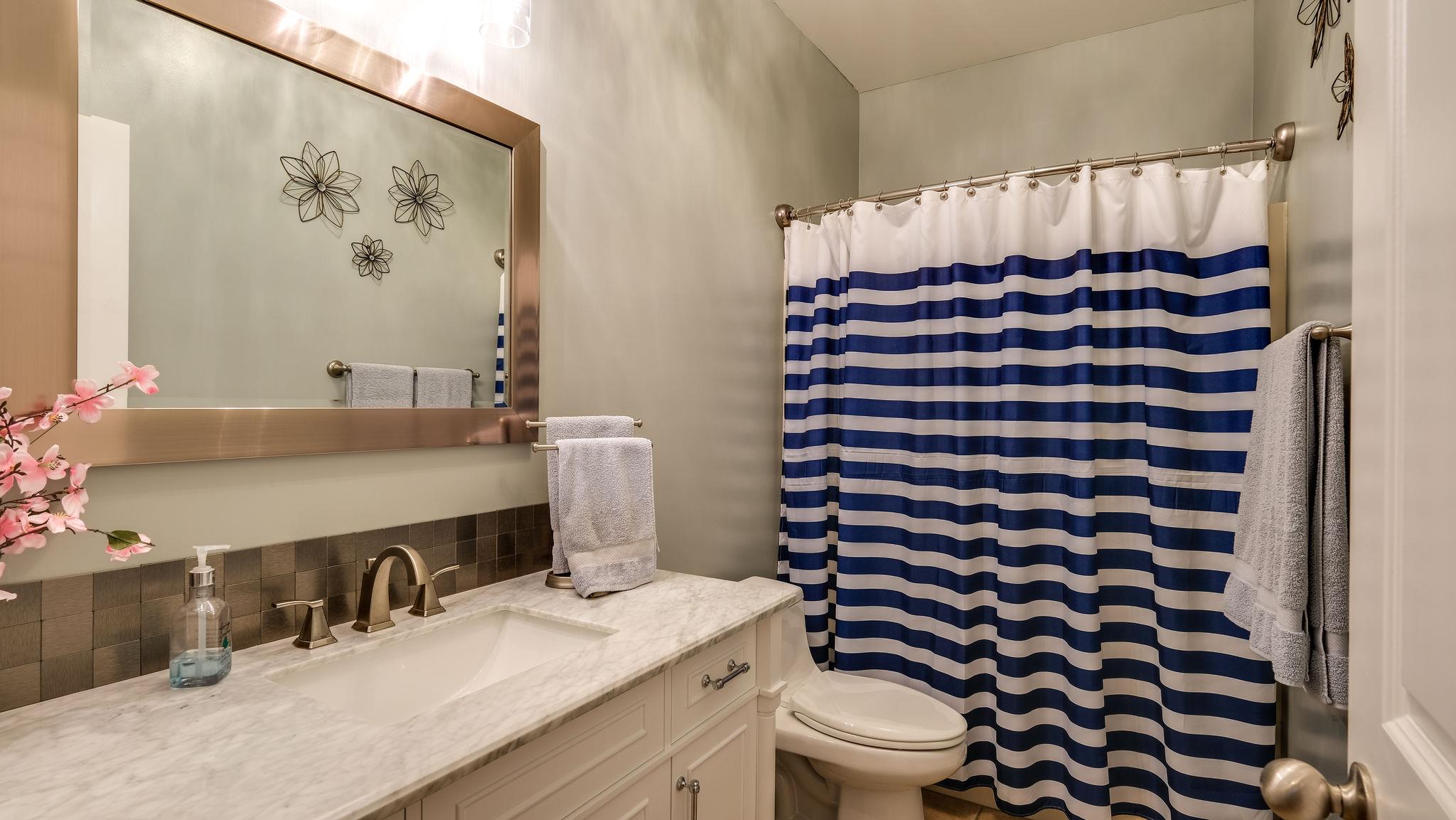 7920 Powells Chapel Road Murfreesboro, TN 37129 - Photo 14 of 29 a bathroom with a sink toilet and shower