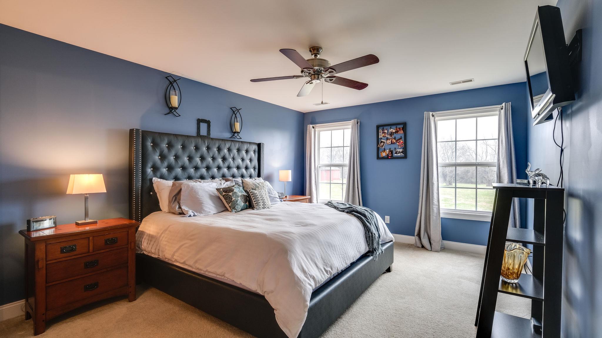 7920 Powells Chapel Road Murfreesboro, TN 37129 - Photo 19 of 29 a bedroom with a bed and a flat tv screen on a dresser
