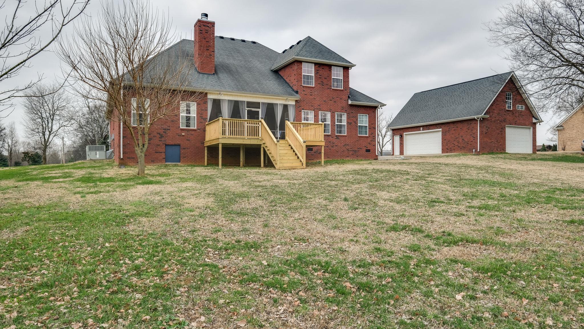 7920 Powells Chapel Road Murfreesboro, TN 37129 - Photo 24 of 29 a front view of a house with a yard