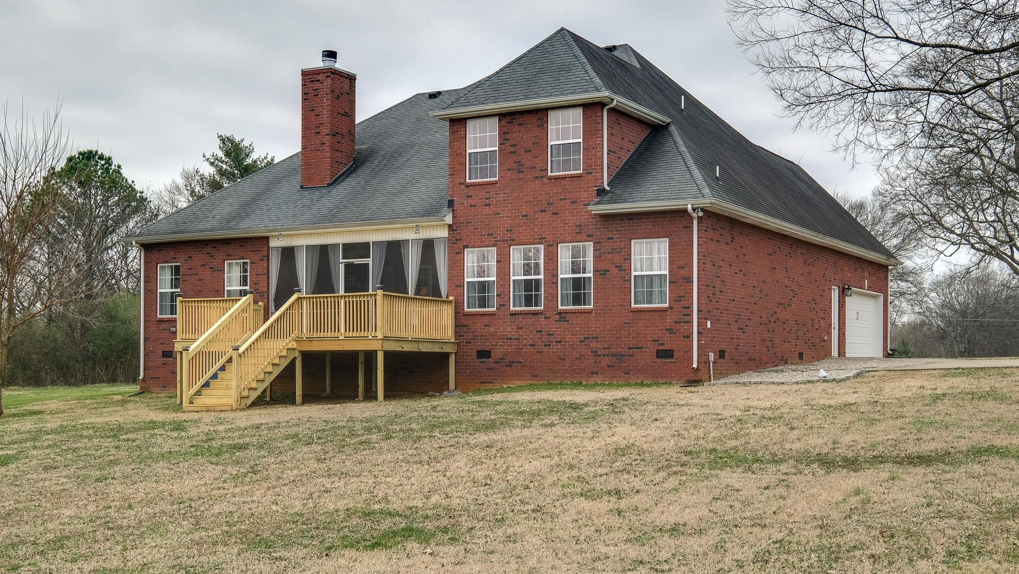 7920 Powells Chapel Road Murfreesboro, TN 37129 - Photo 25 of 29 a front view of a house with a yard