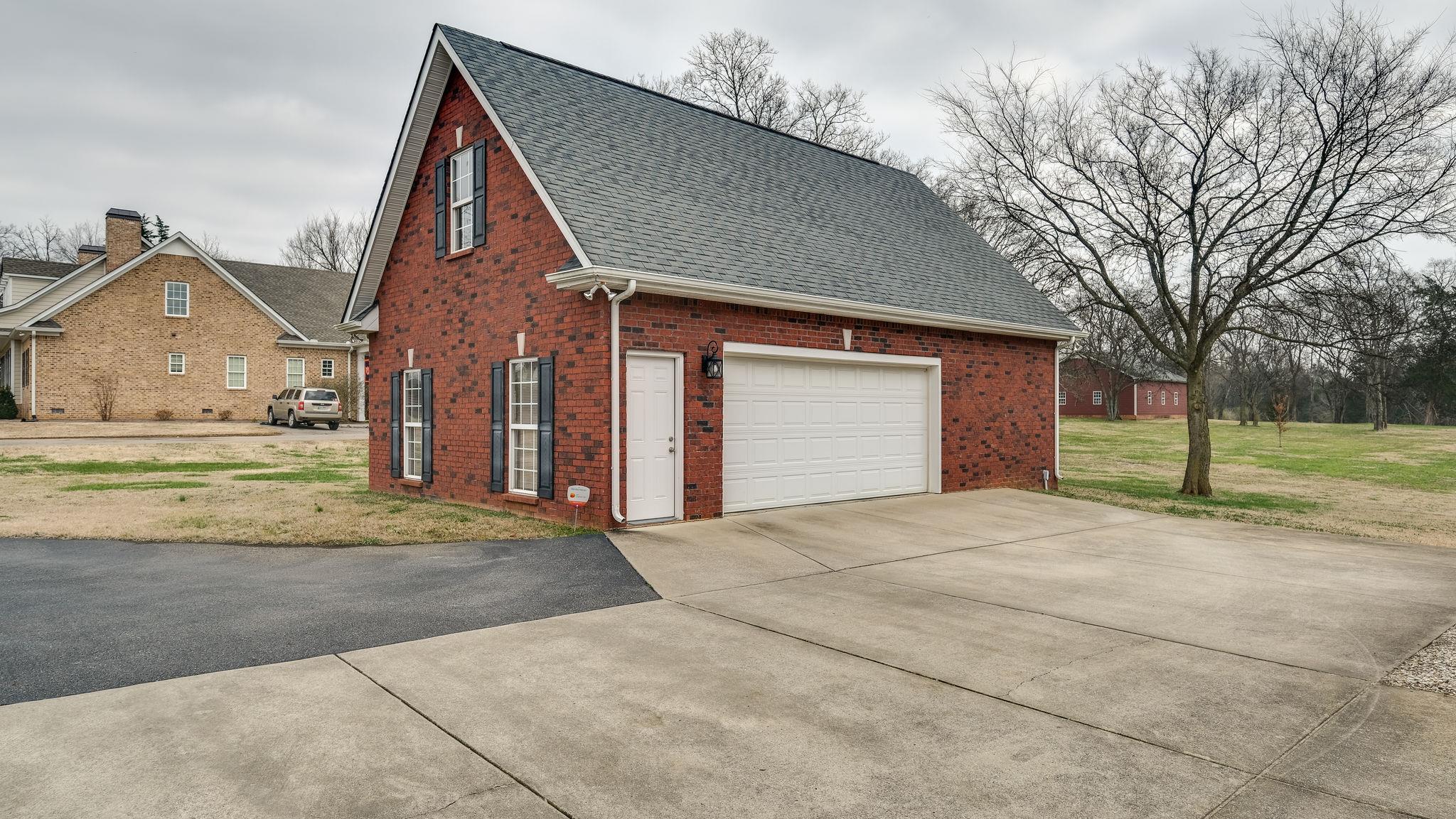 7920 Powells Chapel Road Murfreesboro, TN 37129 - Photo 26 of 29 a front view of a house with a yard
