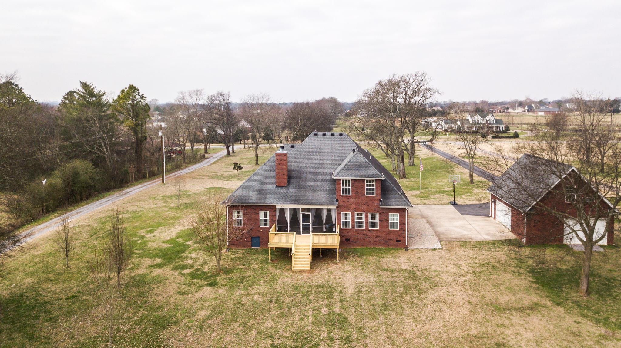 7920 Powells Chapel Road Murfreesboro, TN 37129 - Photo 27 of 29 a view of a house with a yard from a lake view