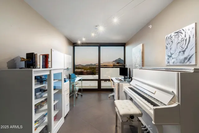 a living room with furniture and large window