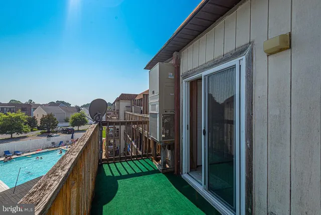 a view of wooden house with a large window