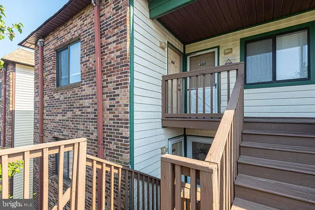 an aerial view of a house with balcony and outdoor space