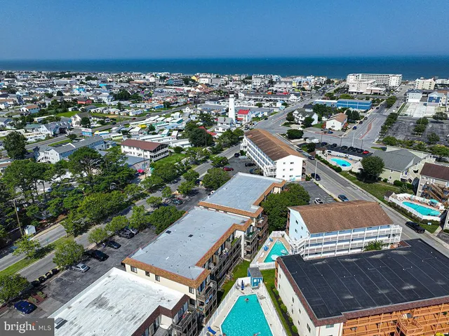 an aerial view of residential houses and city street