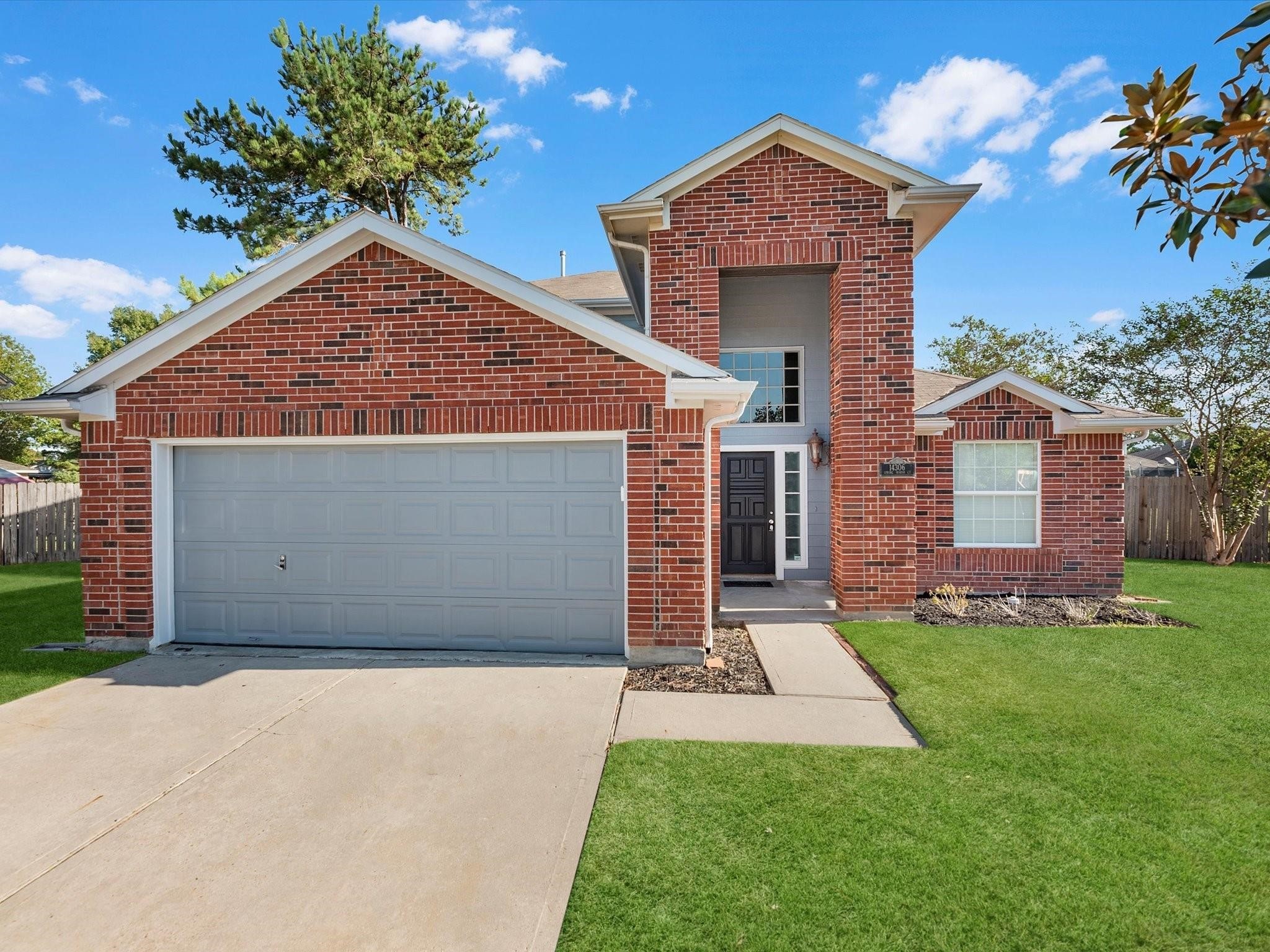 14306 Spring Marsh Court Cypress, TX 77429 - Photo 1 of 26 front view of a house with a yard