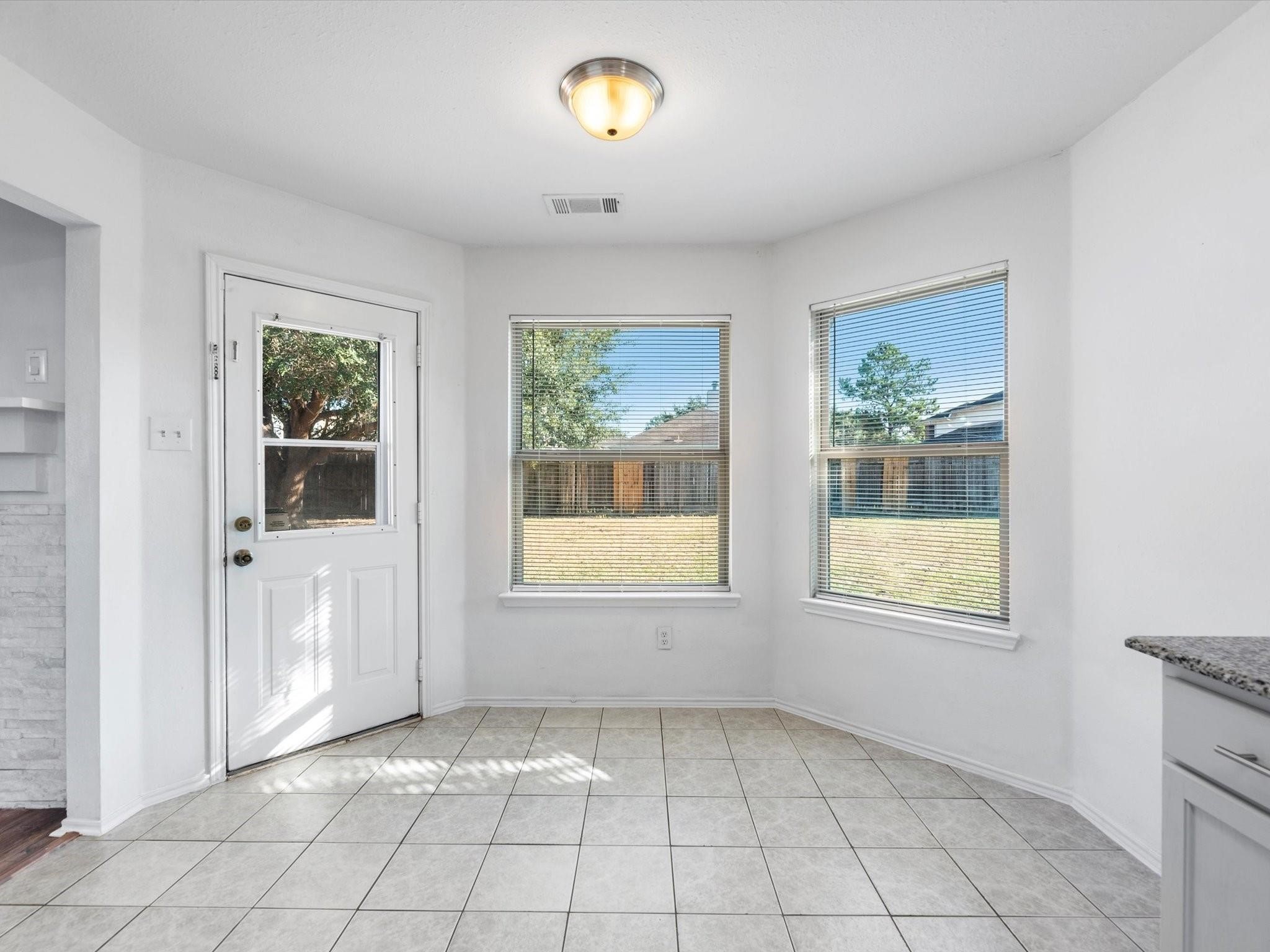 14306 Spring Marsh Court Cypress, TX 77429 - Photo 12 of 26 a view of an empty room with window and cabinet