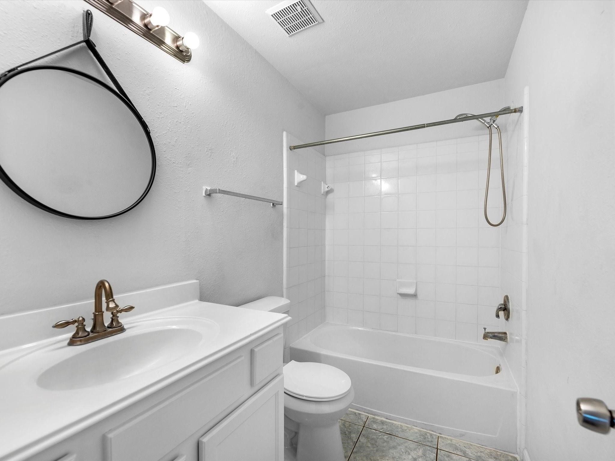 14306 Spring Marsh Court Cypress, TX 77429 - Photo 16 of 26 a bathroom with a sink a toilet and a mirror