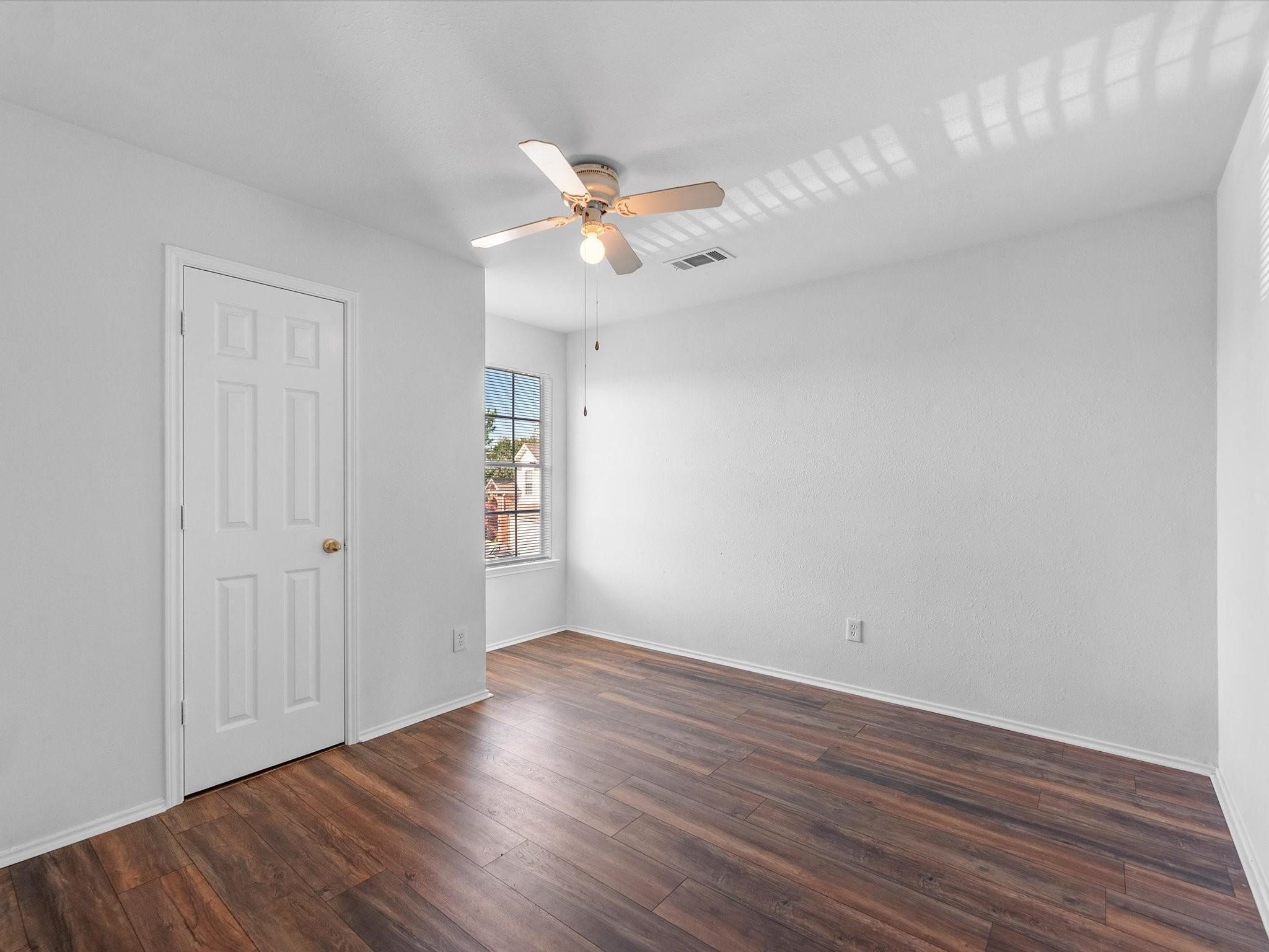 14306 Spring Marsh Court Cypress, TX 77429 - Photo 21 of 26 a view of an empty room with wooden floor