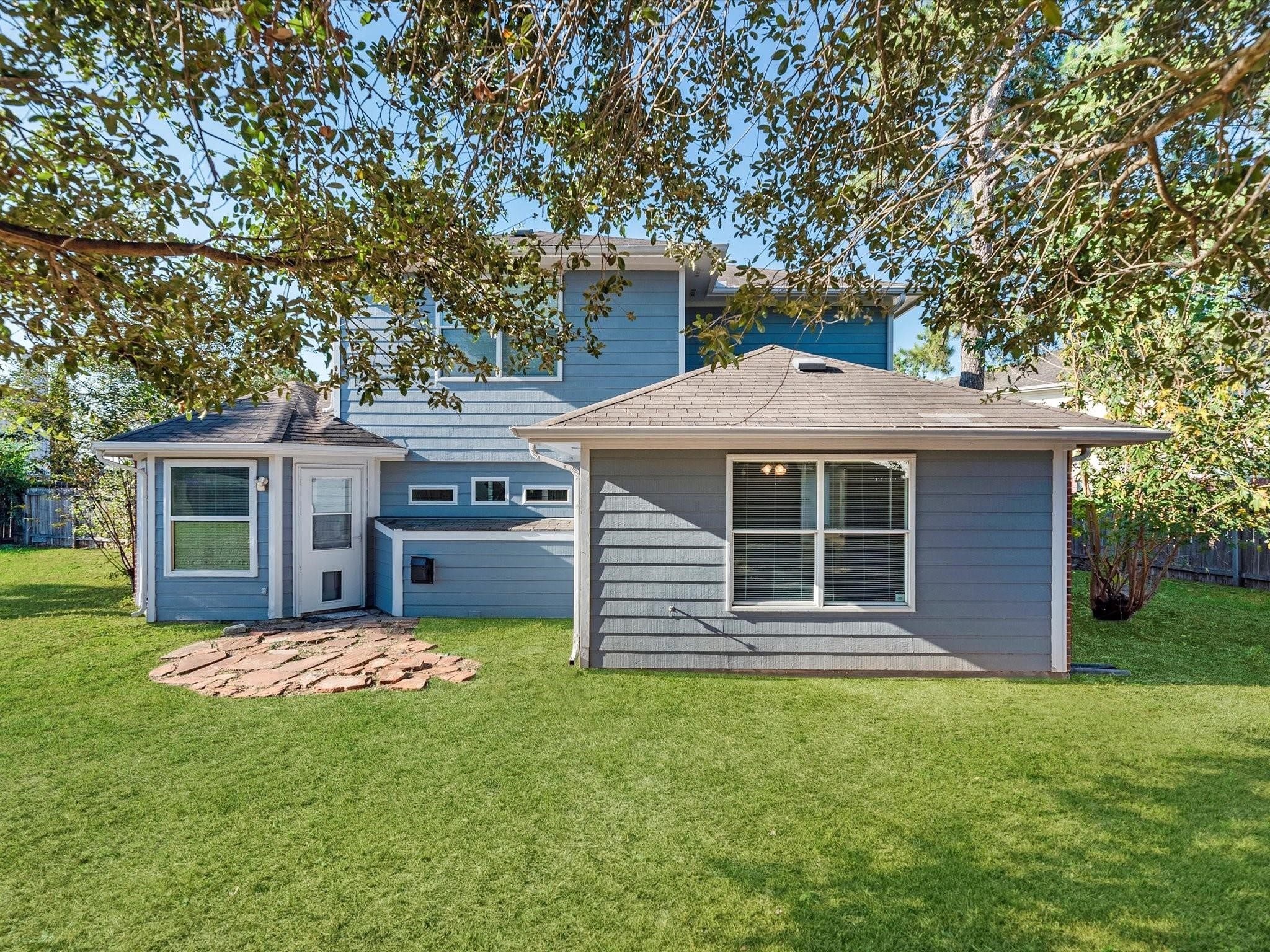 14306 Spring Marsh Court Cypress, TX 77429 - Photo 25 of 26 a front view of a house with garden