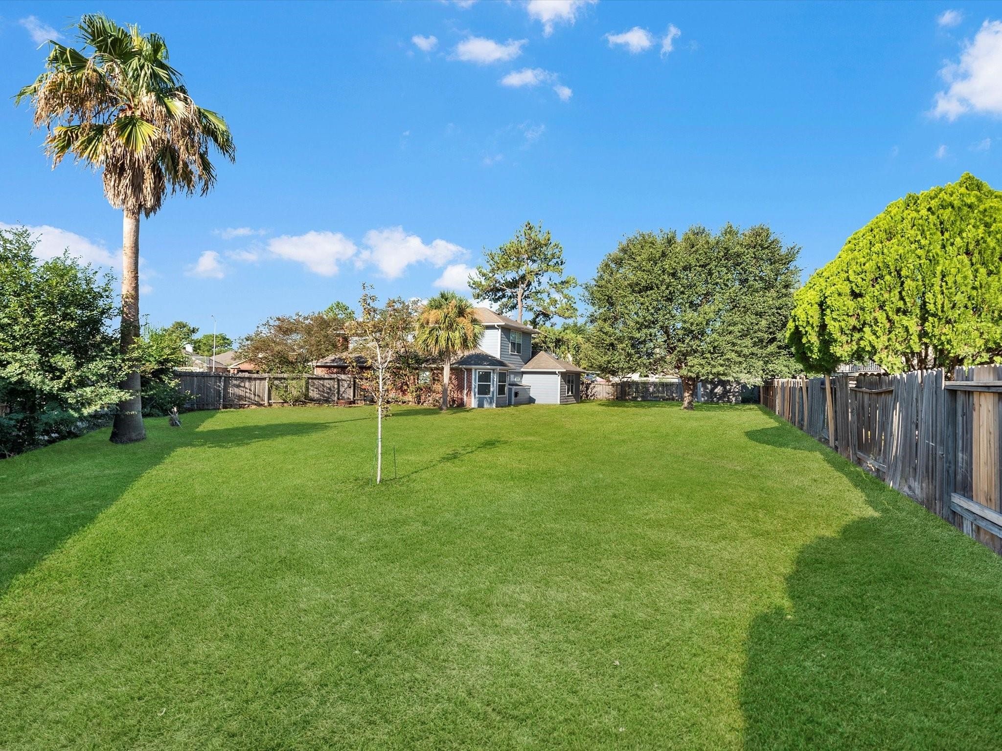 14306 Spring Marsh Court Cypress, TX 77429 - Photo 26 of 26 a garden with trees in front of it