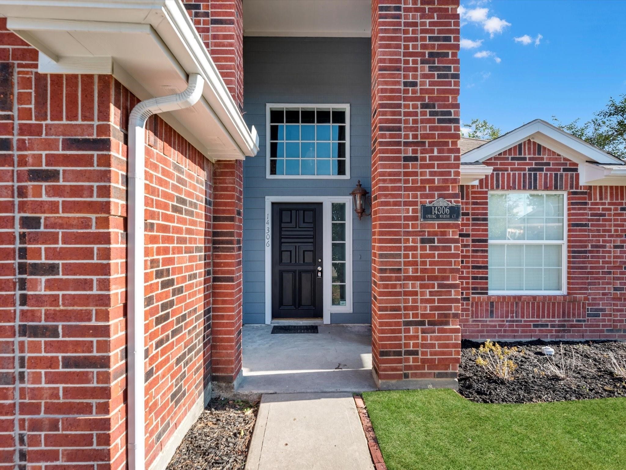 14306 Spring Marsh Court Cypress, TX 77429 - Photo 3 of 26 a front view of a house with a garden