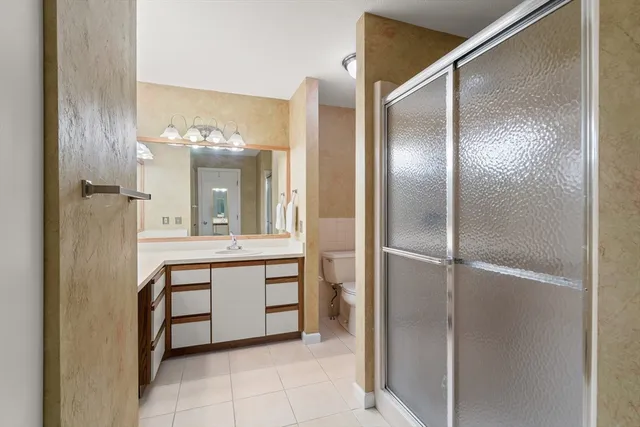 a bathroom with a sink vanity and a mirror
