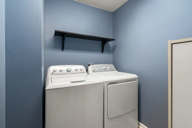 a view of a hallway with a room