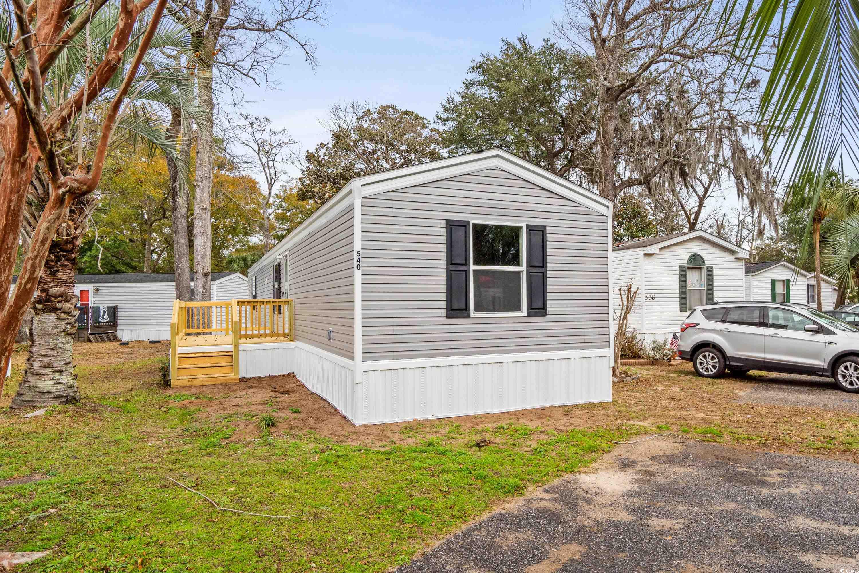 540 Key Largo Avenue Murrells Inlet, SC 29576 - Photo 1 of 34 View of side of home