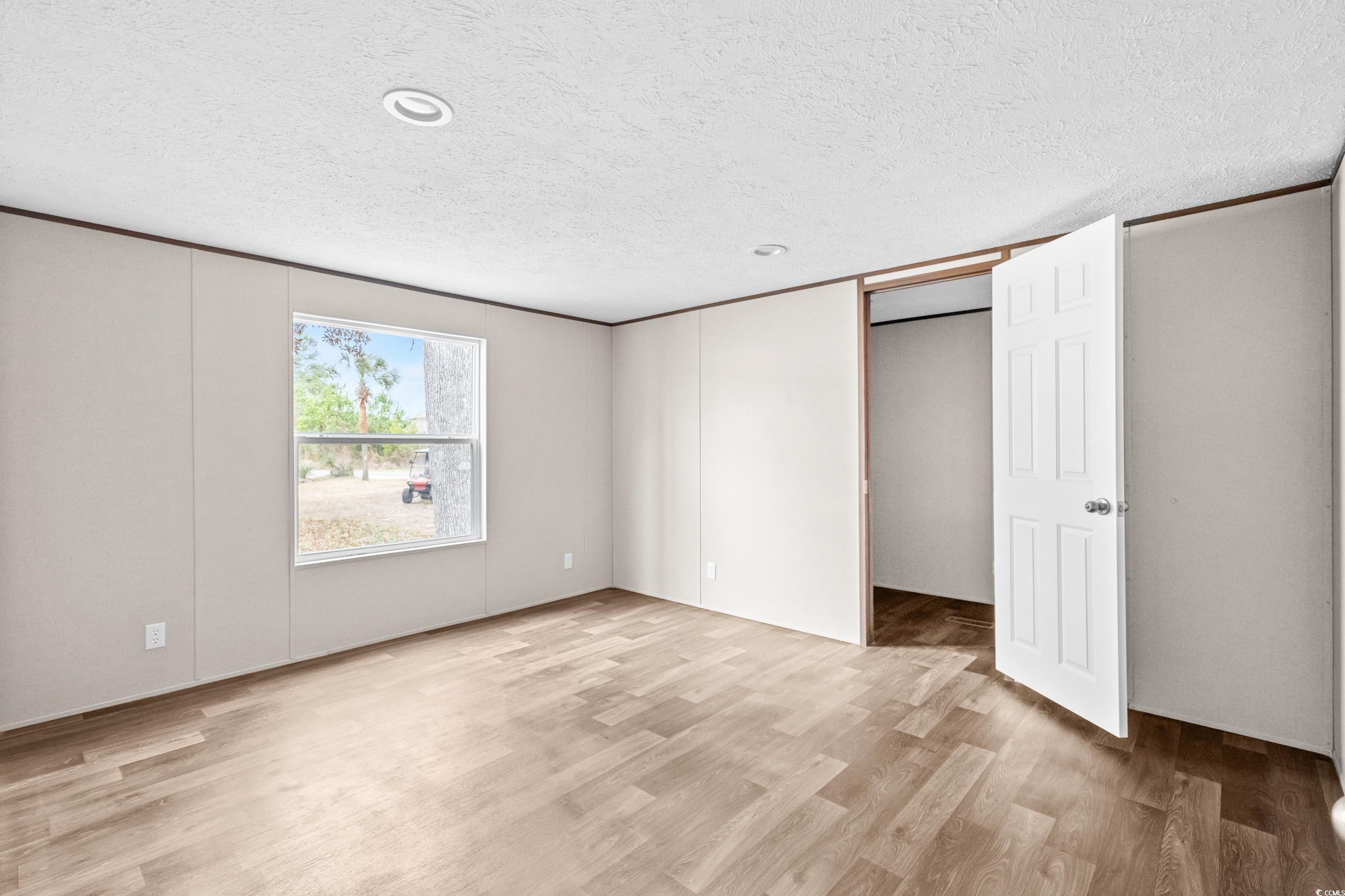 540 Key Largo Avenue Murrells Inlet, SC 29576 - Photo 12 of 34 Unfurnished bedroom featuring a textured ceiling a