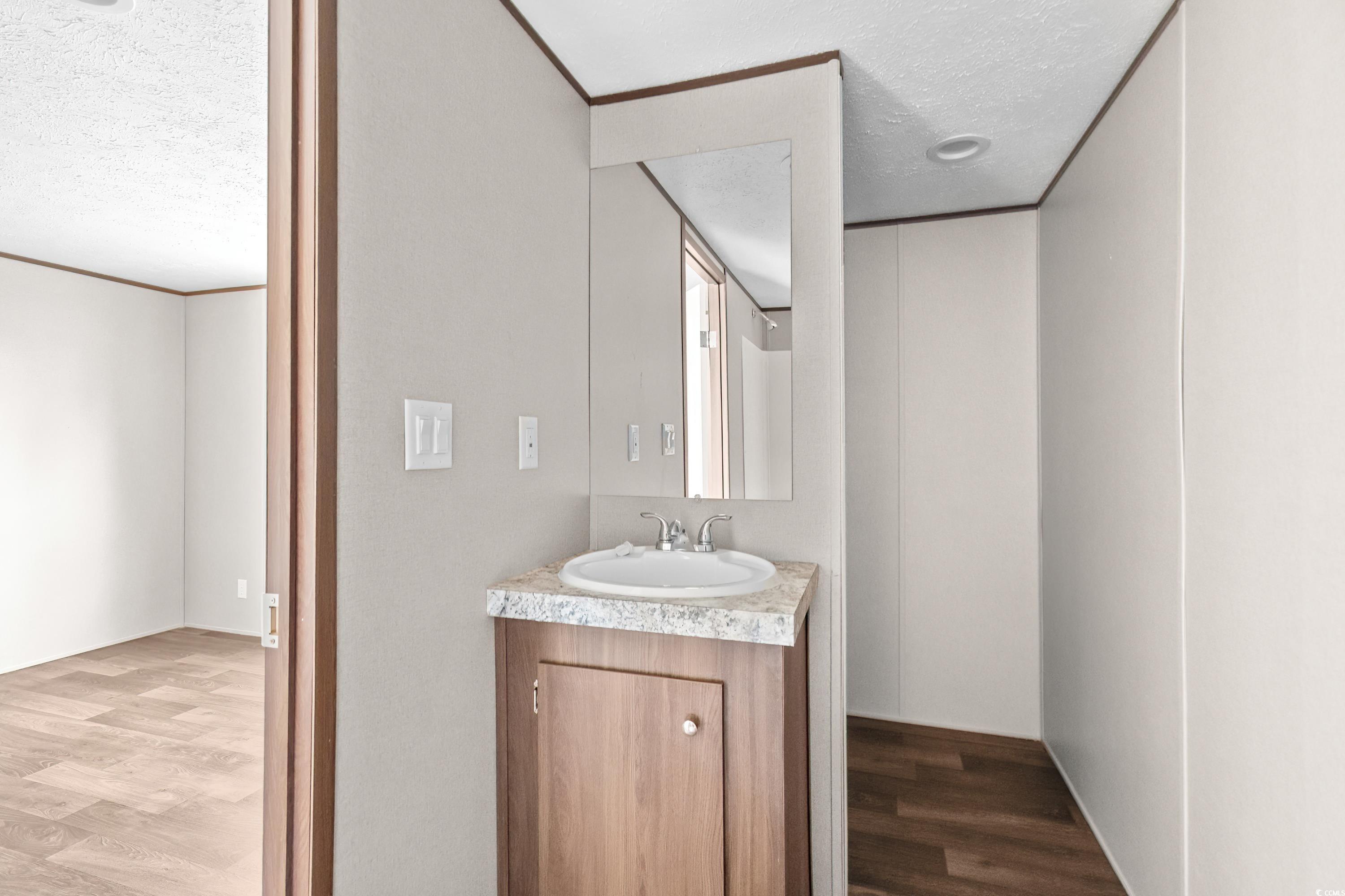 540 Key Largo Avenue Murrells Inlet, SC 29576 - Photo 13 of 34 Bathroom featuring hardwood / wood-style flooring,