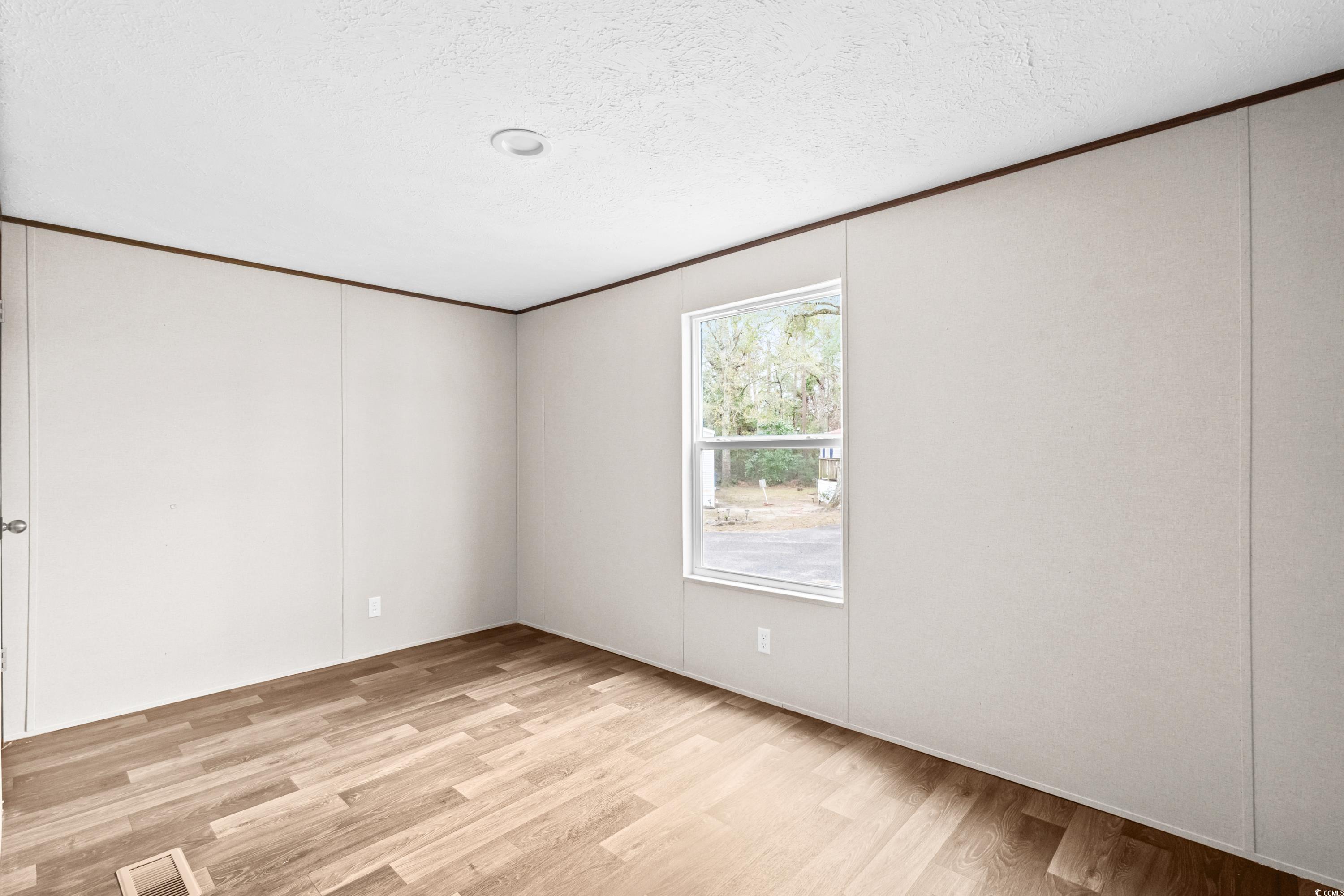 540 Key Largo Avenue Murrells Inlet, SC 29576 - Photo 15 of 34 Unfurnished room with a textured ceiling and light