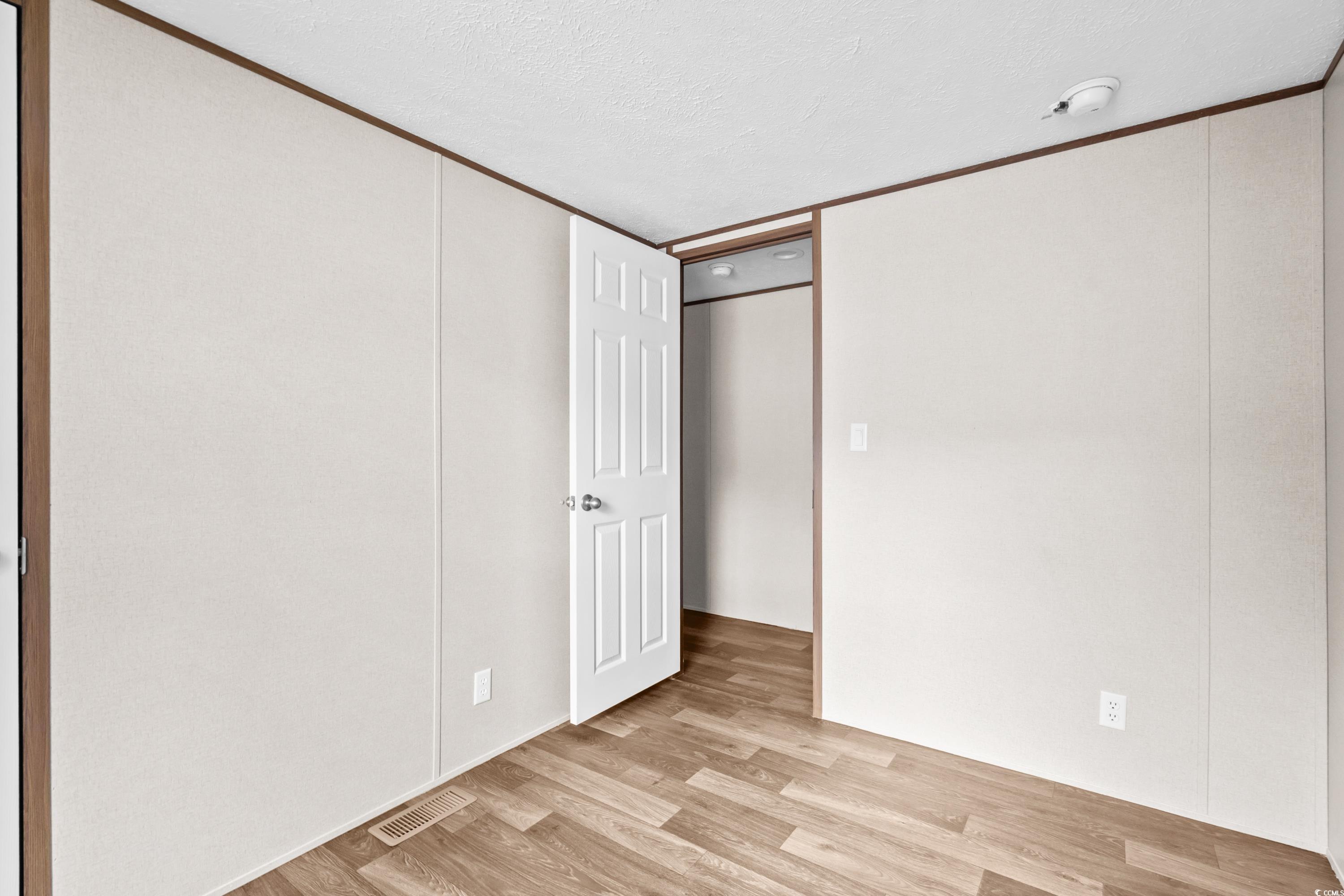 540 Key Largo Avenue Murrells Inlet, SC 29576 - Photo 18 of 34 Unfurnished bedroom featuring light hardwood / woo