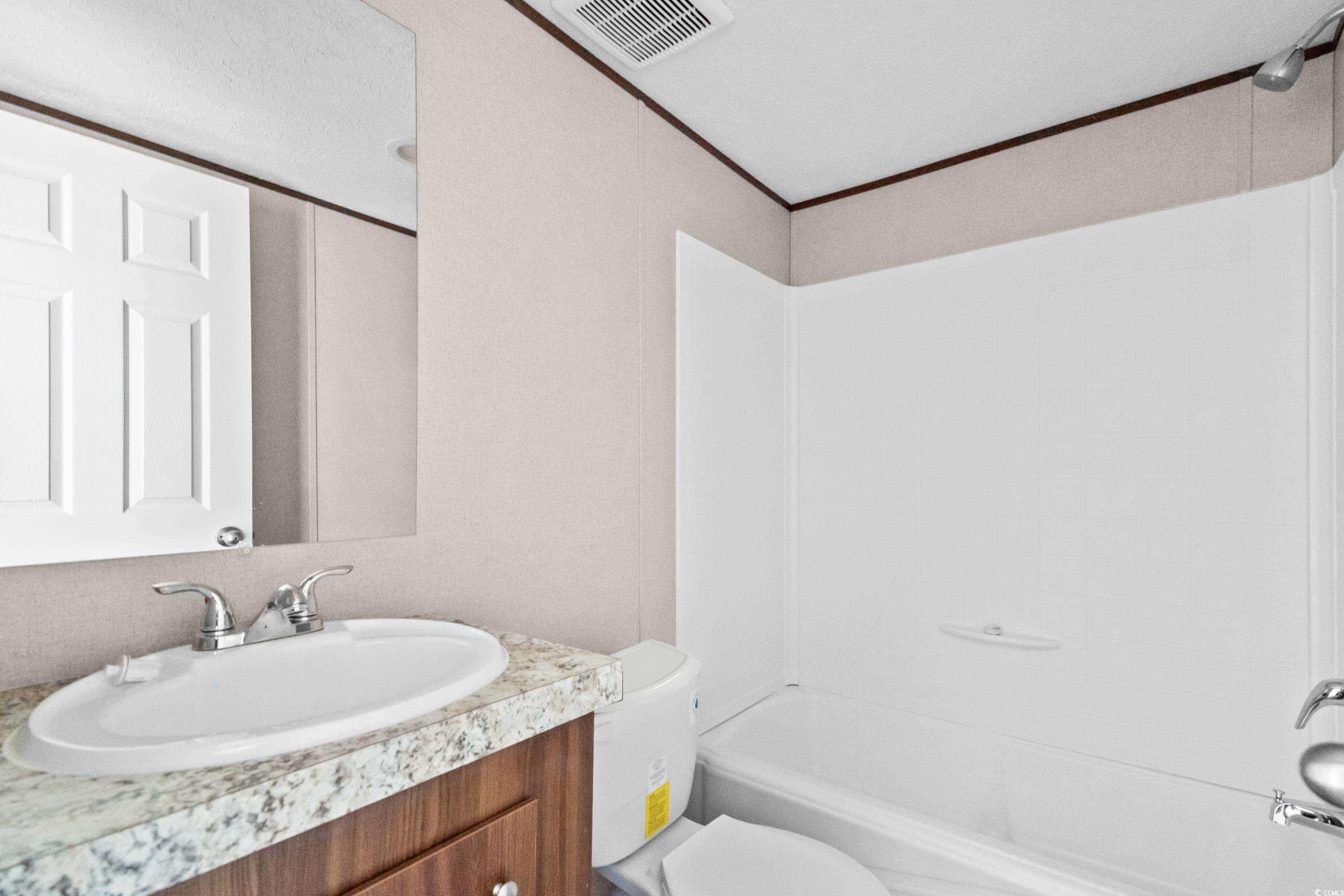 540 Key Largo Avenue Murrells Inlet, SC 29576 - Photo 19 of 34 Full bathroom with vanity, toilet, and shower / wa