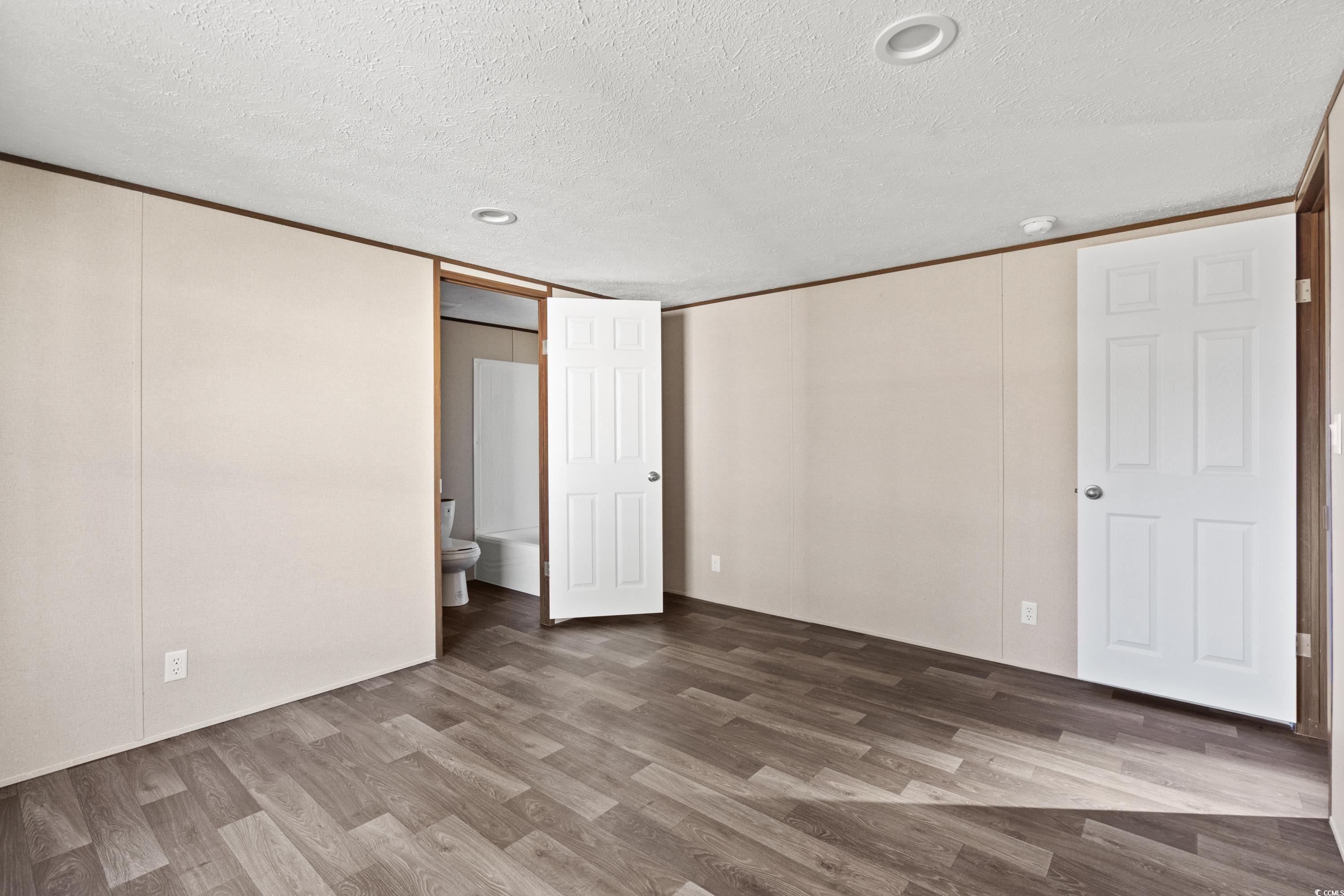 540 Key Largo Avenue Murrells Inlet, SC 29576 - Photo 10 of 34 Unfurnished bedroom featuring crown molding, ensui