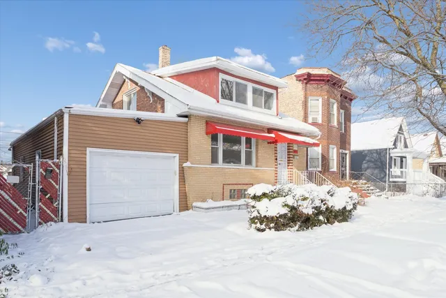 a front view of a house with a snow