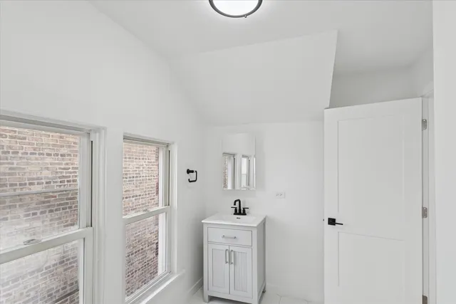 a view of a kitchen from the hallway
