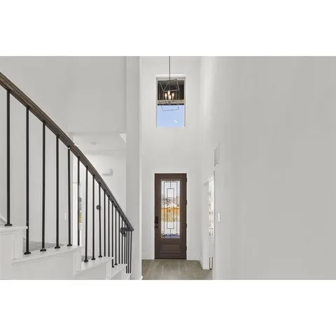 a view of a hallway with staircase